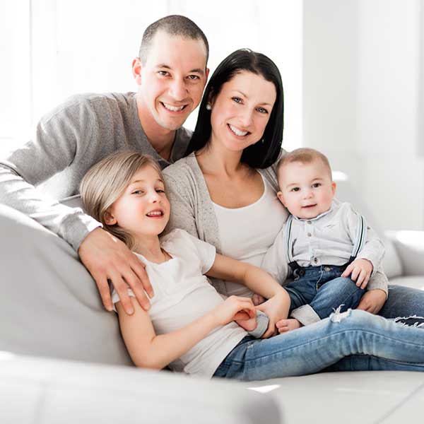 Family seating on sofa